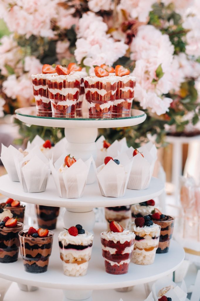 Sweet table at the wedding. Table with cakes and sweets at the festival